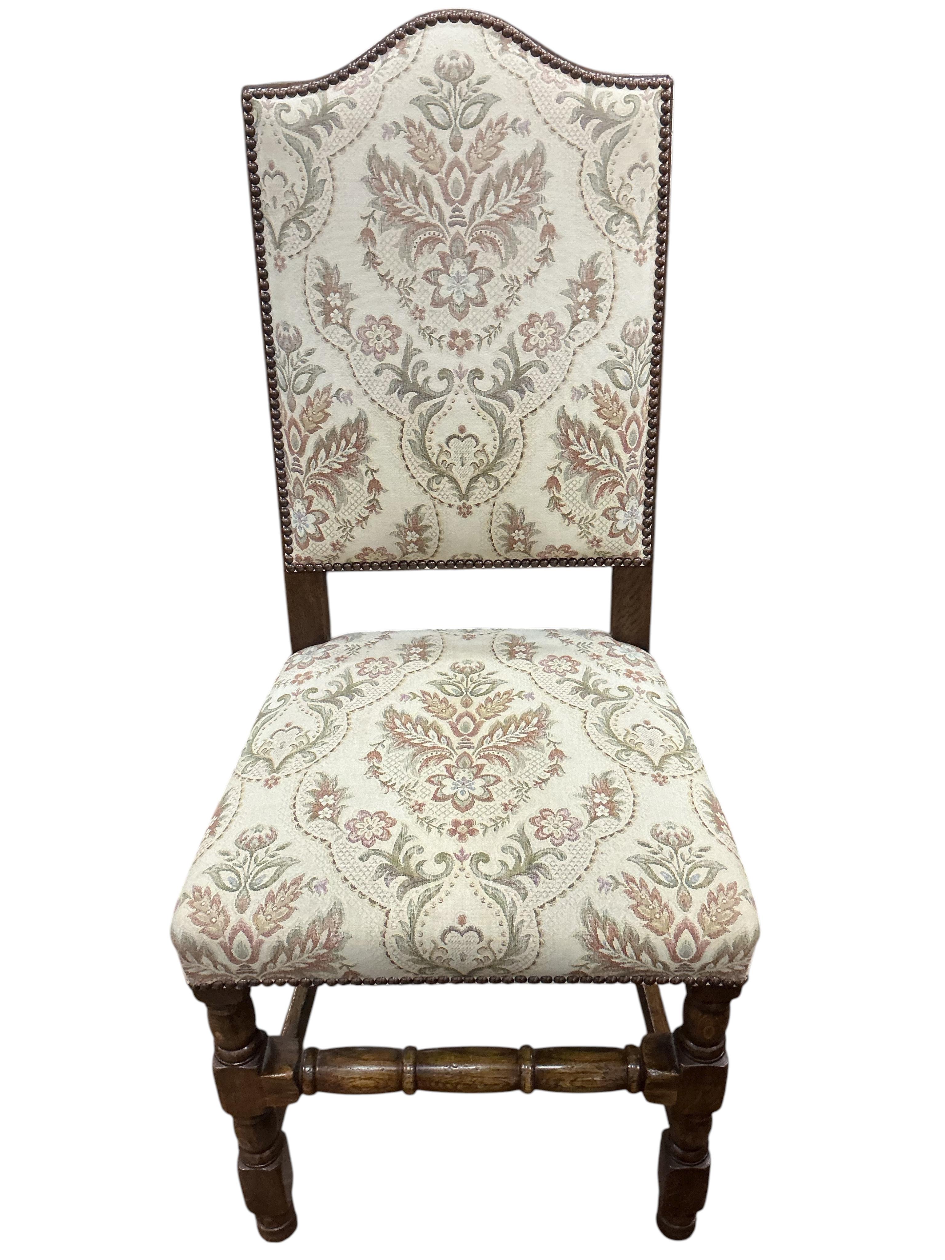 A set of eight 18th century style upholstered oak dining chairs, two with arms